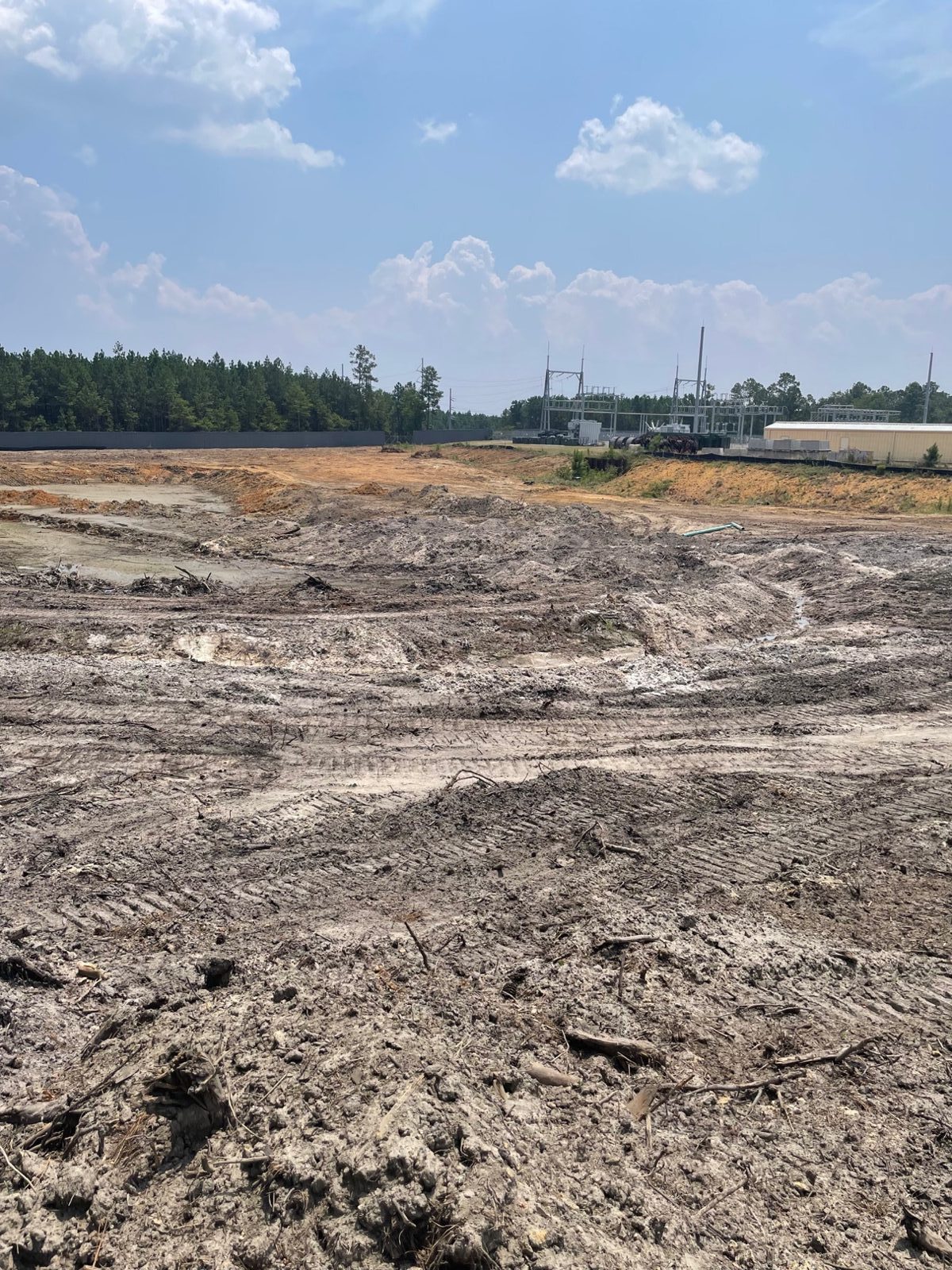 Leveled building pad at the Minder - Phase&nbsp;1 site, late July 2026